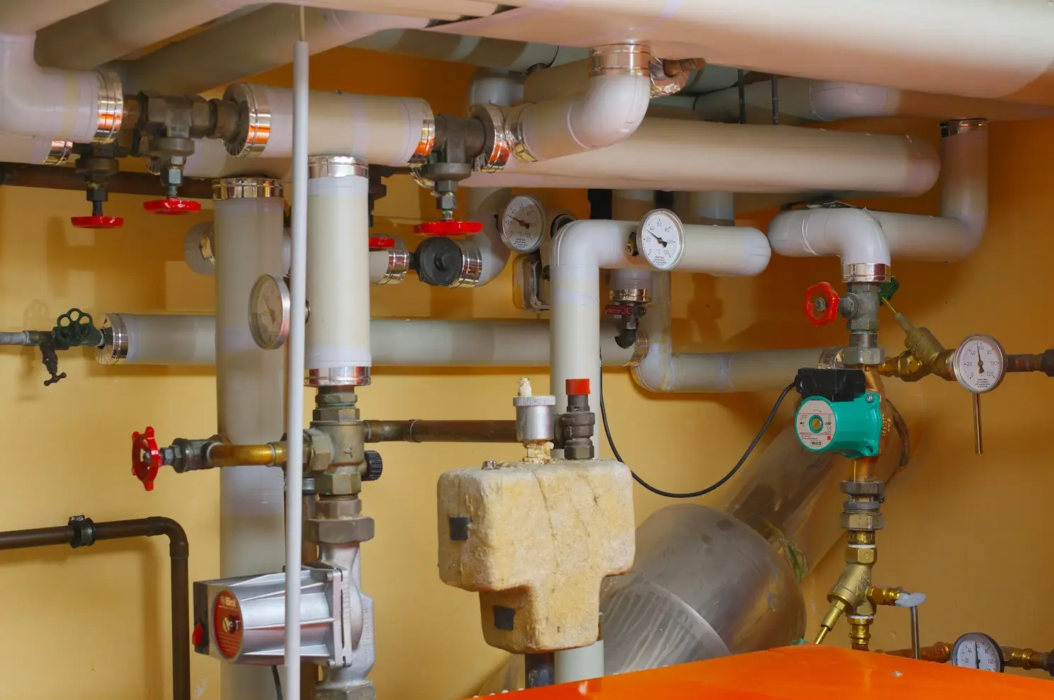 Mechanical room with boiler and heating pipes