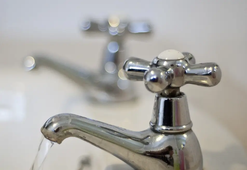 Chrome faucet with running water
